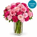 Roses and carnations set in a beautiful glass vase