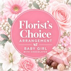 An arragement of flowers in a box for a baby girl with a box of chocolates