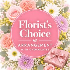 Florists choice arrangement in a box with a box of chocolates