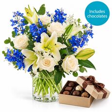 Blue and cream blooms with box of chocolates