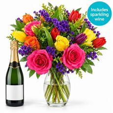 Beautiful bright bunch and a bottle of sparkling wine