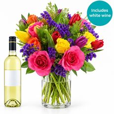 Bright bunch with bottle of white wine perfect for birthdays