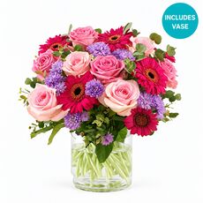 Our favourite flowers roses and gerberas set in a lovely keepsake vase