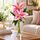 2 lovely oriental lilies set in to a glass bud vae