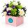A beautiful colour combination of lilac and lime blooms set in a box