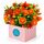 Gorgeous mixed orange blooms set in a boxed arrangement