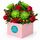 A lovely mix of red and green blooms designed to brighten a room