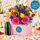 Bright boxed arrangment with a bottle of sparkling
