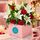 red roses and white lilies in a box