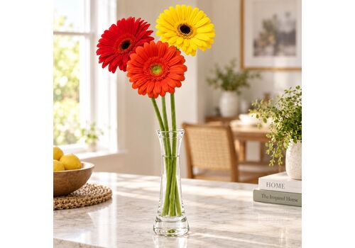 3 gerberas with a glass vase