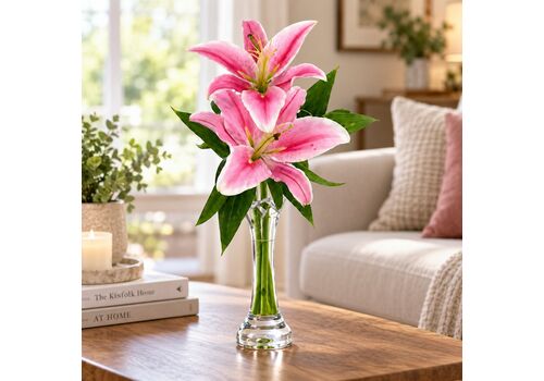 2 lovely oriental lilies set in to a glass bud vae