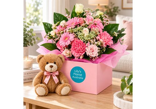 Arrangement for a baby girl with teddy bear