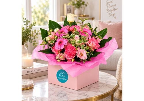 Stunning pink fresh blooms arranged in a boxed arrangement