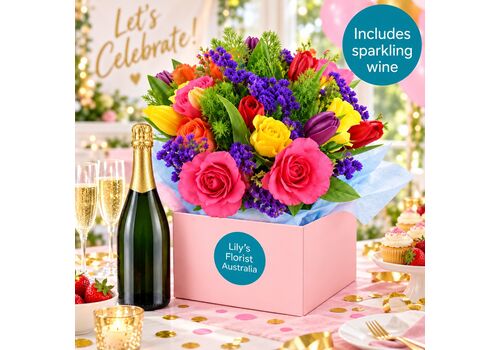 Bright boxed arrangment with a bottle of sparkling