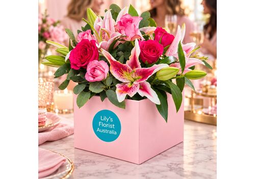 pink lily and roses in a box