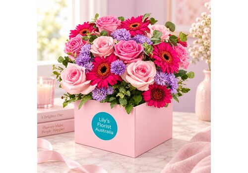 roses and gerberas in a boxed arrangement