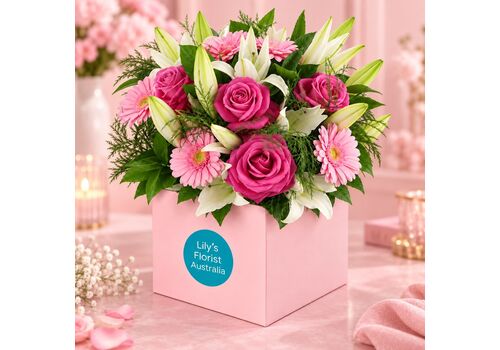 roses, gerberas and lily in a box
